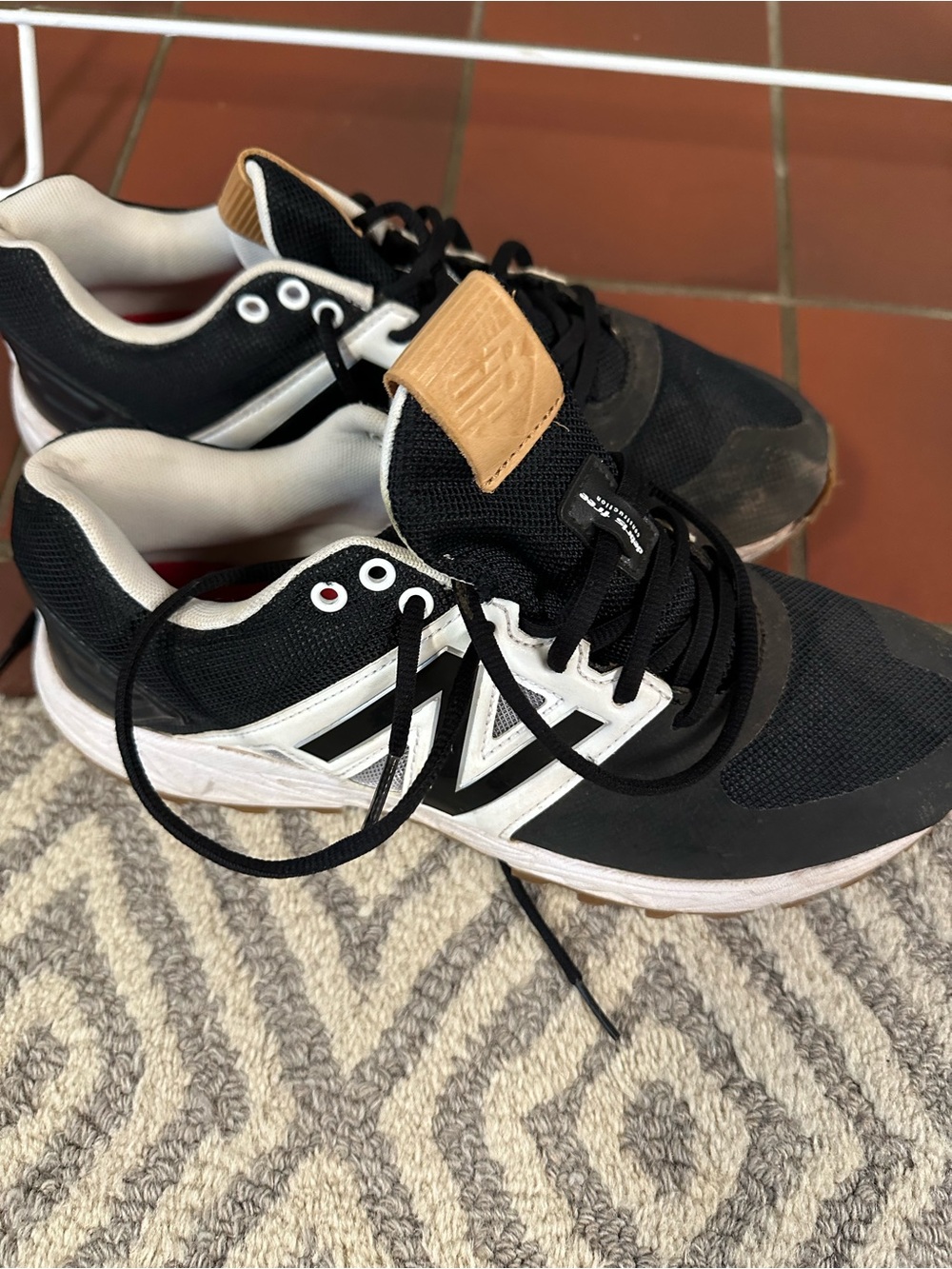 New Balance Men’s Black and White Turf Sneakers 10.5